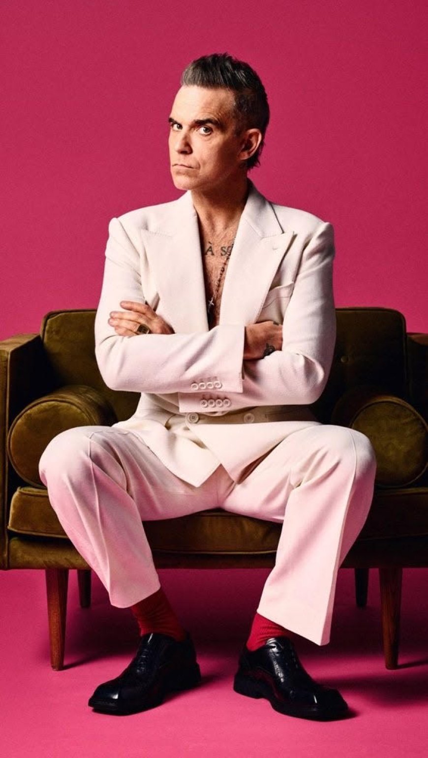 Robbie Williams vraagt selfies in het centrum van Amsterdam