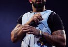 Drake ontvangt gesigneerd George “The Iceman” Gervin-tricot
