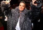 Robbie Williams voelt schaamte ondanks geluk